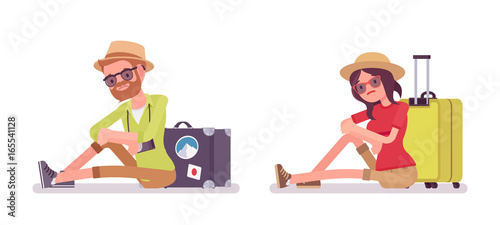Tourist man and woman sitting on the floor