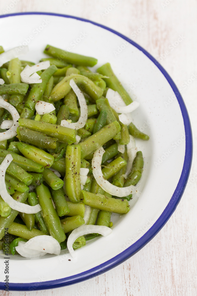boiled green beans in dish on wooden background boiled green beans in dish on wooden background