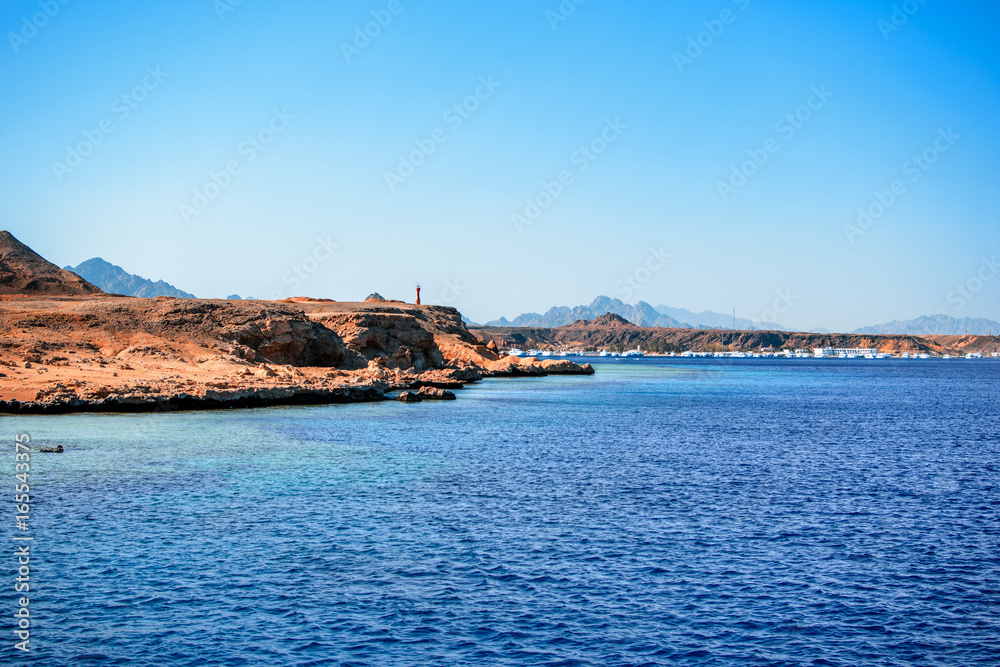 View to rocky coast and red sea
