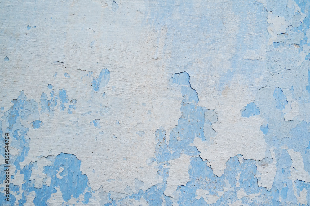 Fototapeta premium White blue wall with scratches and cracks
