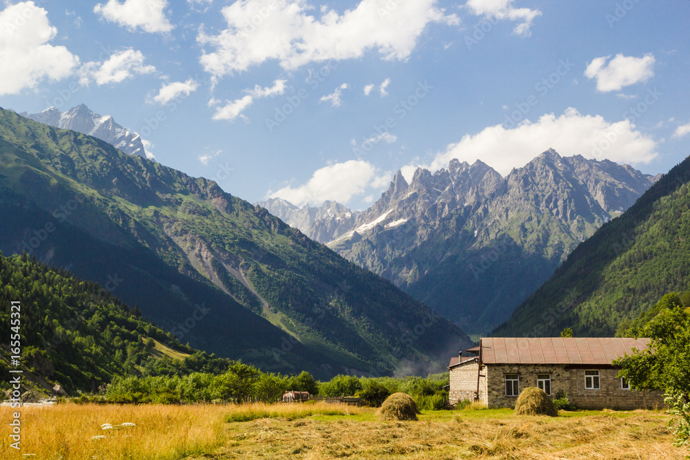 Caucasus mountains and old house in svaneti village Mestia landscape