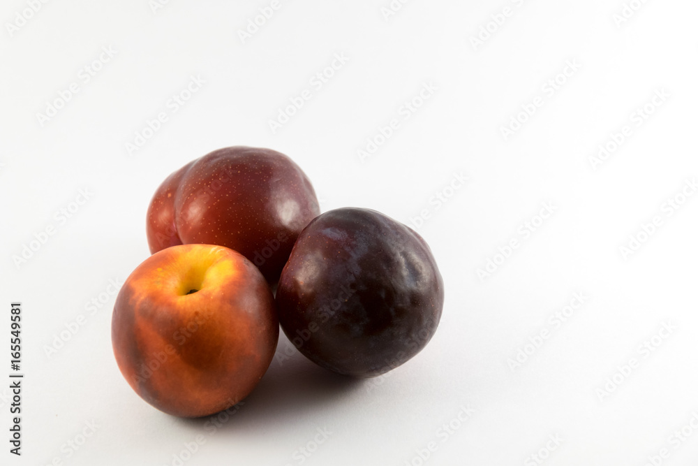organic red and yellow plums
