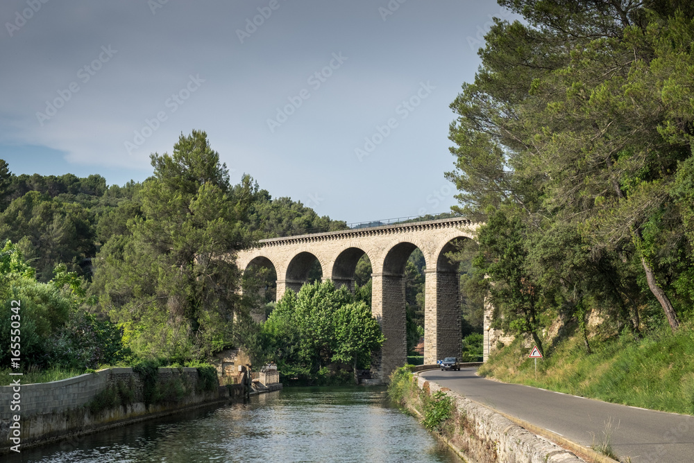 Ancient Galas Aqueduct at Fontaine-de-Vaucluse village. Provence. France