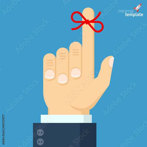 Businessman's hand with red bow 