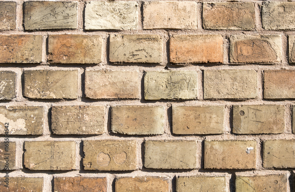Fototapeta premium Mauer aus gelben Ziegelsteinen