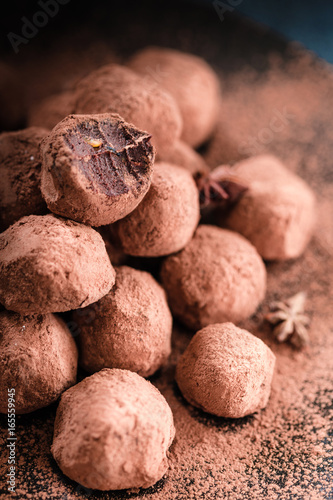 Close Up Vertical View of Paleo Chocolate Balls on Dark Background