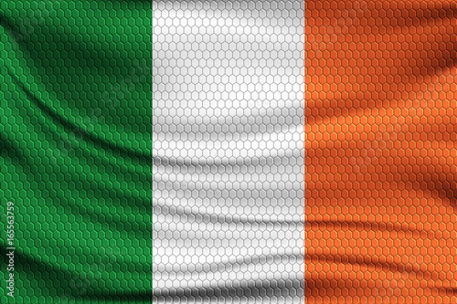 National flag of Ireland on wavy fabric with a volumetric pattern of hexagons. Vector illustration.