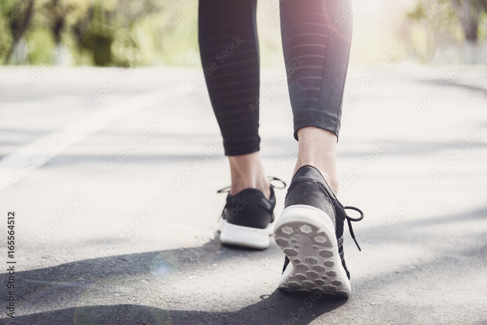 Young beautiful sportive girl preparing to run