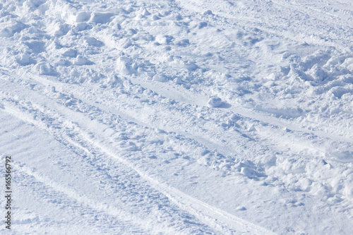 Traces of skis on snow as background