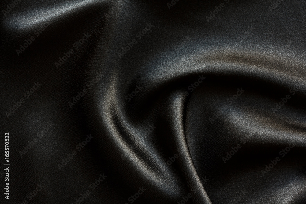 Fototapeta premium black satin fabric with large folds, abstract background