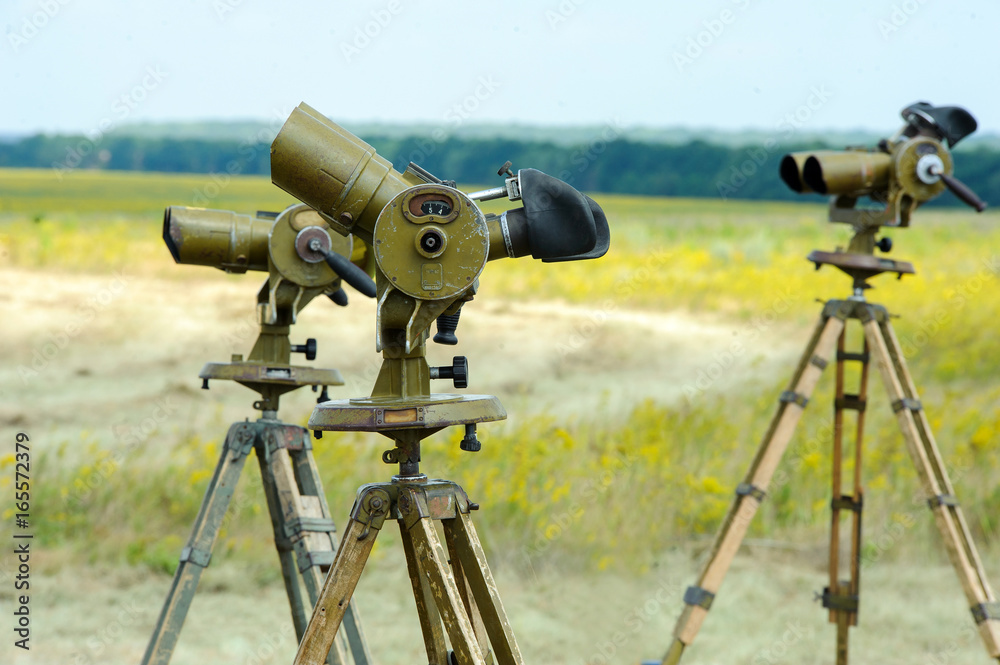 Military binoculars on the ground for parachutists Military binoculars on the ground for parachutists