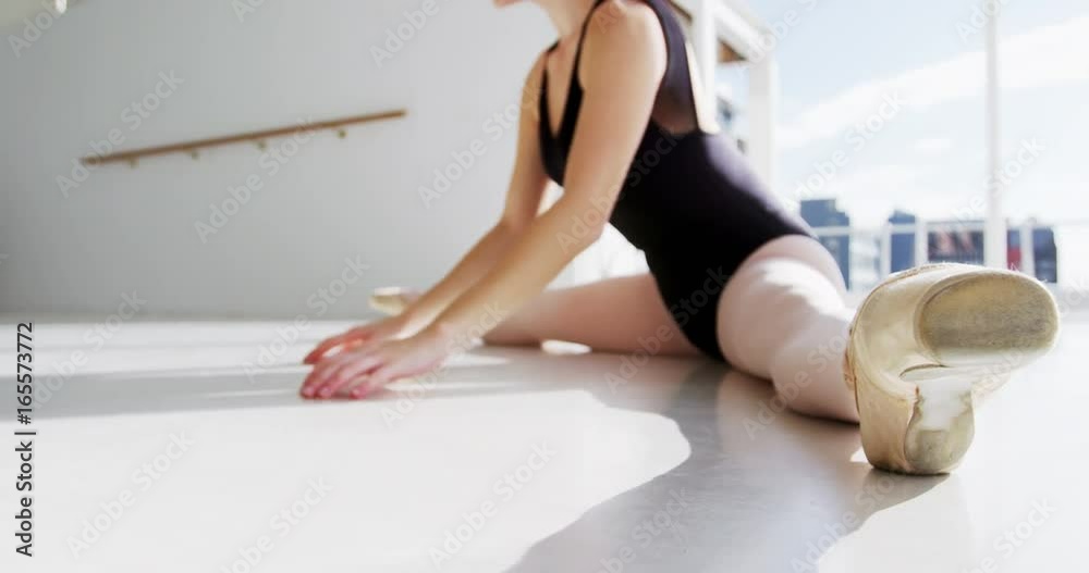 Ballerina performing a split Ballerina performing a split