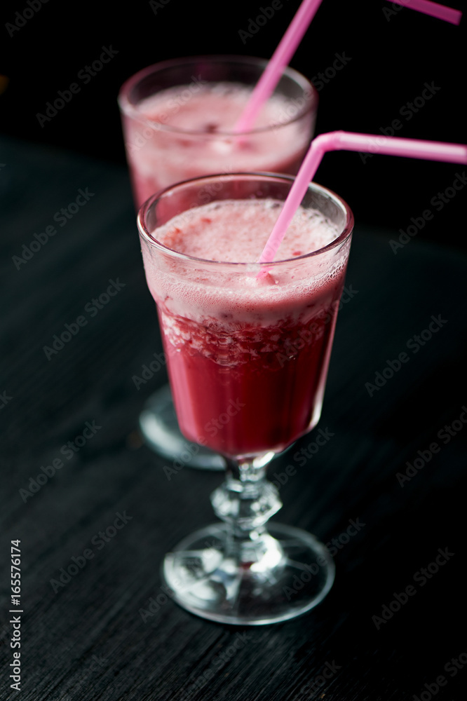 Fresh cool smoothie in a glass with a stem. Delicious and healthy Breakfast. Of cherries and strawberries Fresh cool smoothie in a glass with a stem. Delicious and healthy Breakfast. Of cherries and strawberries