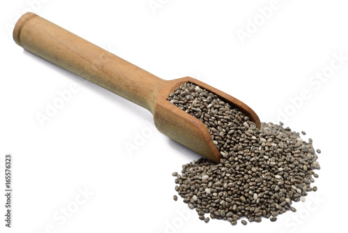 Chia seeds in the wooden shovel, isolated on white
