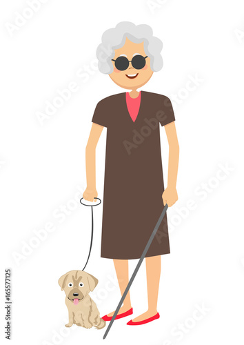 Senior blind woman standing with guide dog