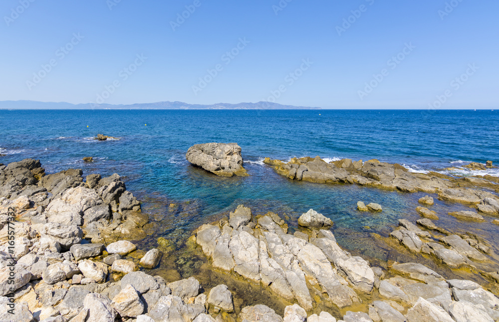 Rocky Mediterranean coast of l'Escala village in Costa Brava, Spain Rocky Mediterranean coast of l'Escala village in Costa Brava, Spain