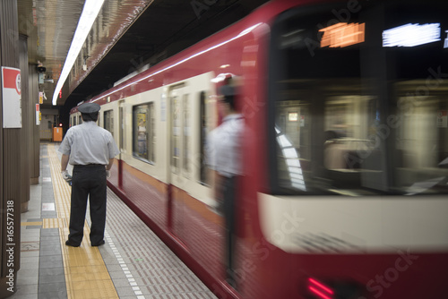 The station master was patrol the train railway at japan