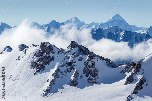Canvas Print Blue snowy mountains in the morning.
