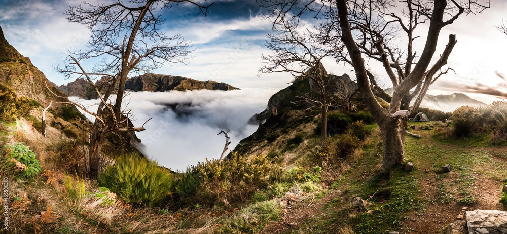 Hiking trail in the mountains above the clouds of Madeira, Portugal