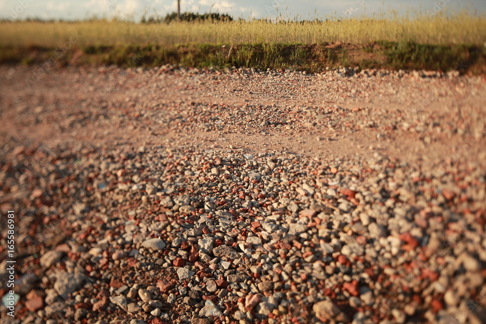 Road is strewn with rubble from pieces of concrete and brick Road is strewn with rubble from pieces of concrete and brick