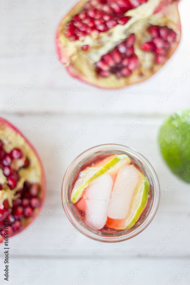 Top view of pomegranate lemonade with lime and ice Top view of pomegranate lemonade with lime and ice