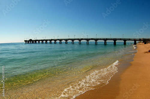 pier into ocean off of beach  © kevin