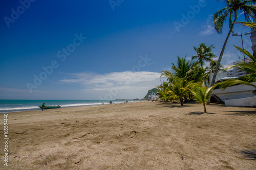 Beautiful view of the beach with sand, in a beautiful day in with sunny weather in a blue sky in Same, Ecuador