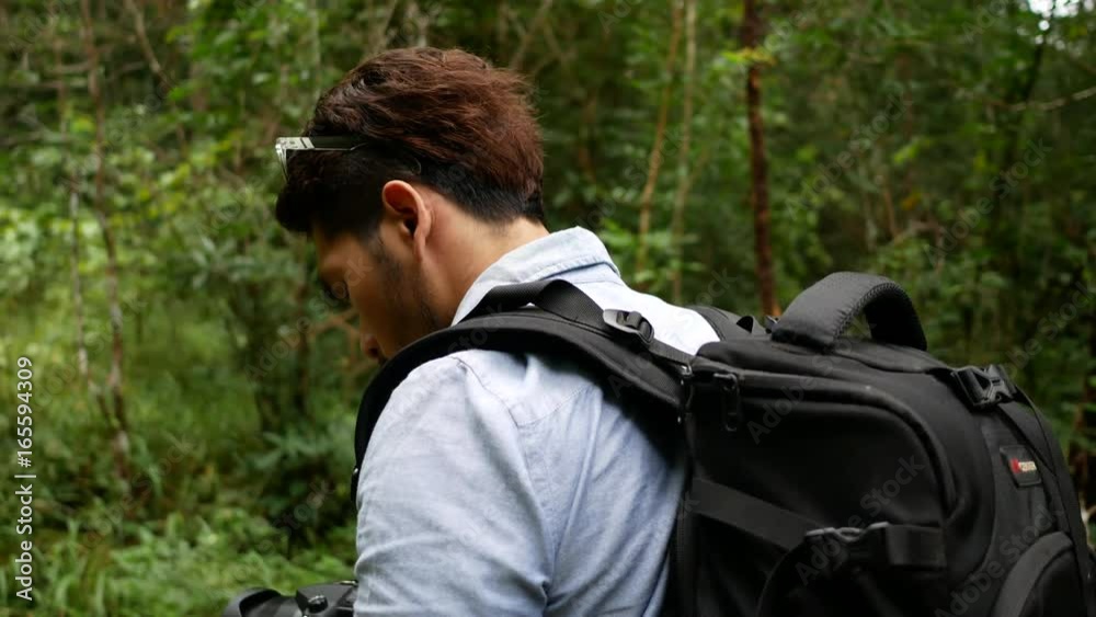 Hiking man take a photo at the forest. Hiking man take a photo at the forest.
