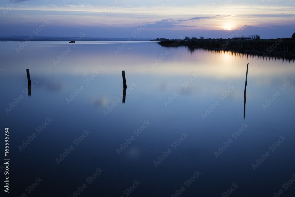 Sunset on blue lake, calm concept