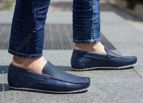 A man in blue moccasins photo