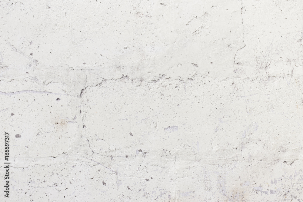 Cracked white concrete wall, abstract texture background