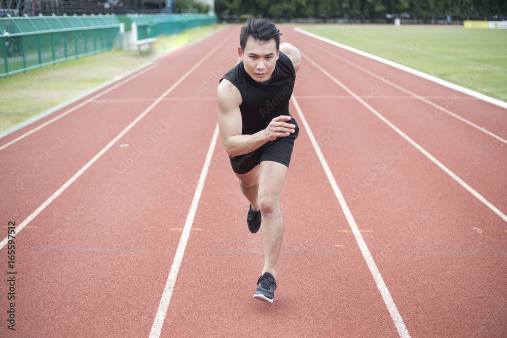 Handsome Sport man running at outdoor city Handsome Sport man running at outdoor city