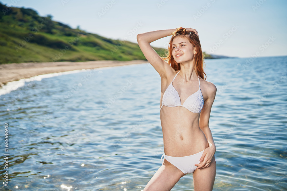 Beautiful young woman resting on the sea, beach, summer, vacation