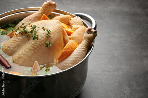 Fényképezés Cooking pot with turkey soaked in flavored brine