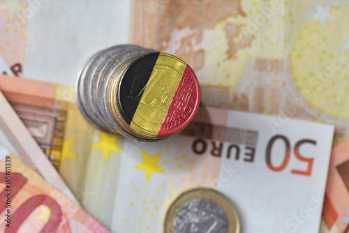 euro coin with national flag of belgium on the euro money banknotes background photo