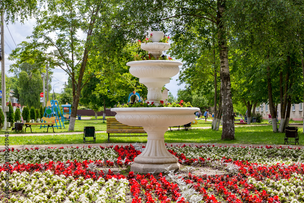 Decorative fountain with flowers in the park