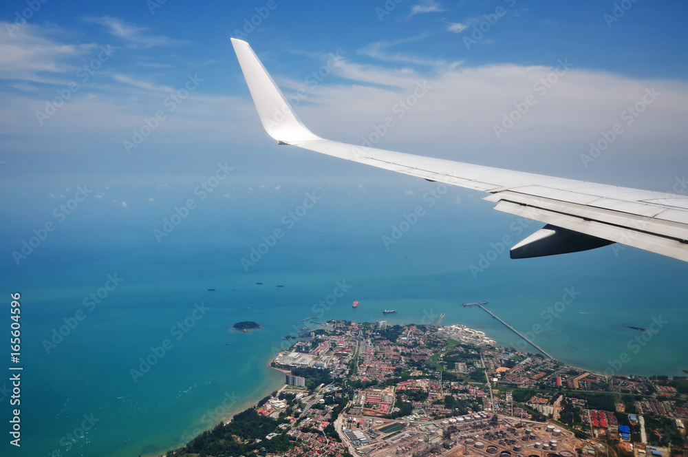 Airplanes wing on the sky with blue sky and clouds. Airplanes wing on the sky with blue sky and clouds.
