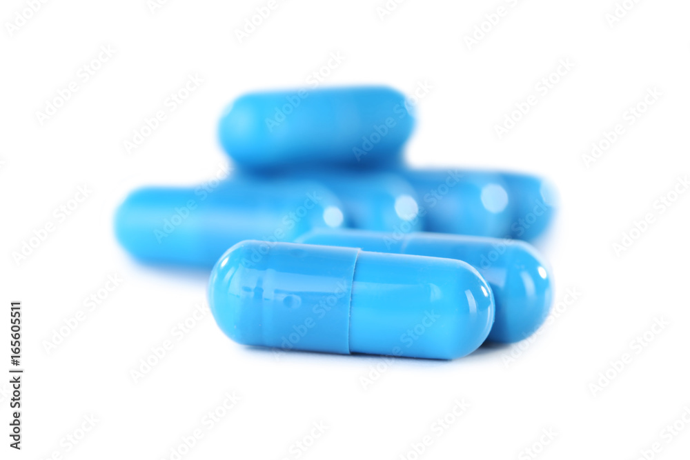 Blue capsules pills isolated on a white background Blue capsules pills isolated on a white background
