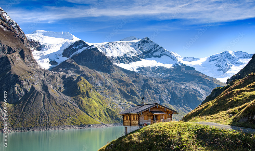 Alpine hut with a great view over an alpine lake and glacier, Kaprun, Salzburger Land, Austria Alpine hut with a great view over an alpine lake and glacier, Kaprun, Salzburger Land, Austria