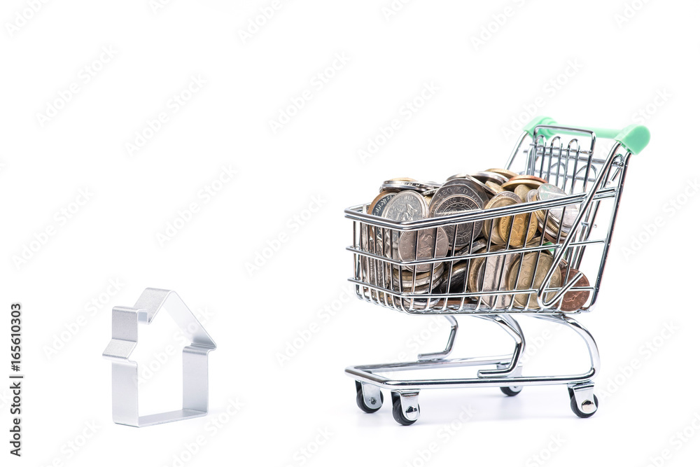 Shopping cart loaded full with coins. Isolated on white Shopping cart loaded full with coins. Isolated on white