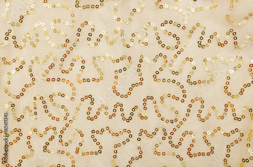 Yellow Background Sequins. Background Sequin. Beads Factories, Glitter surfactant. Holiday Abstract glitter Background with blinking lights. Fashion fabric glitter.