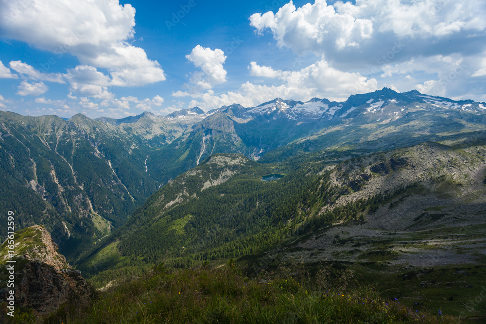 Mountain massifs are found in the sun in the Austrian alps in the summer