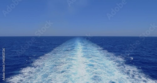 A slow motion view of the wake behind a large cruise ship at sea. Shot at 48fps.  	