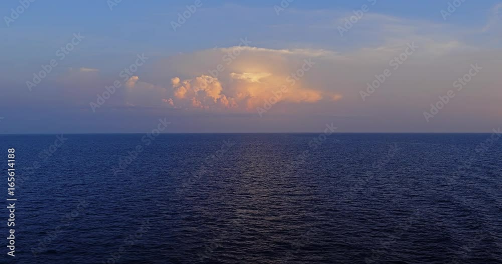 A peaceful sunset view of the horizon over the open ocean. Shot at 48fps. A peaceful sunset view of the horizon over the open ocean. Shot at 48fps.