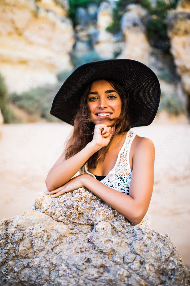 Portrait of beauty latin woman on beach relaxed at summer time