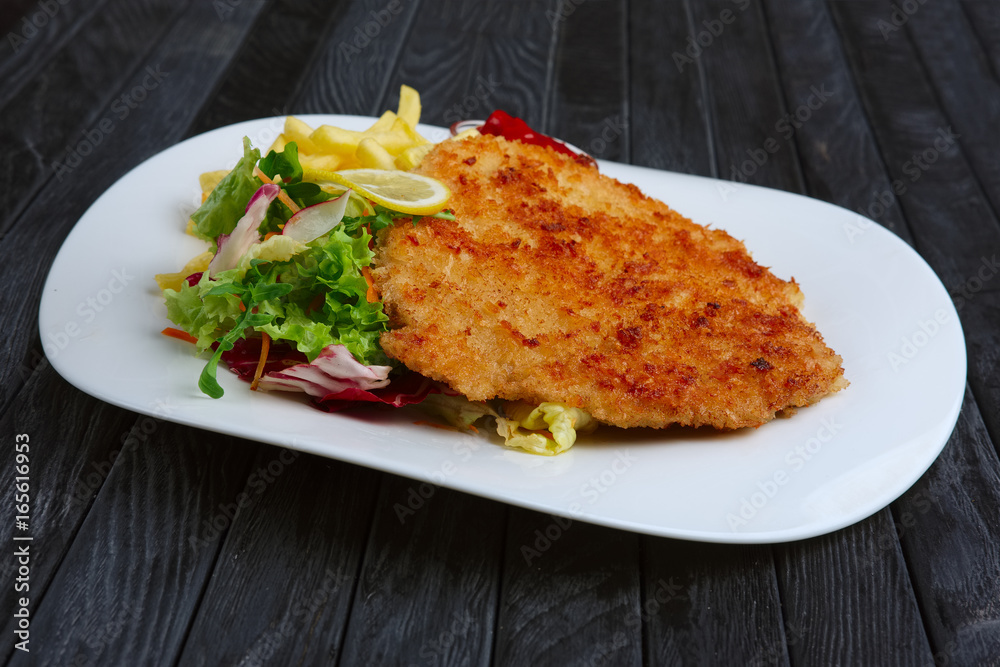 Fried chop pork cutlet with potato and ketchup Fried chop pork cutlet with potato and ketchup