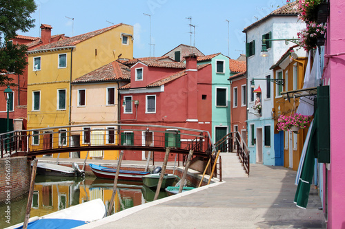 brightly coloured houses and boats on the island of Burano © b_lanka
