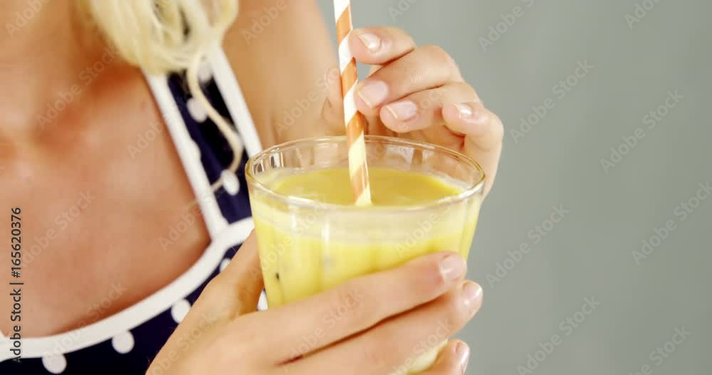 Beautiful woman drinking smoothie Beautiful woman drinking smoothie