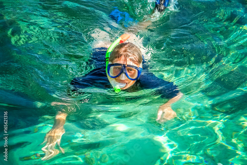 Woman snorkeling in clear ocean waters