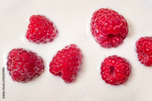 fresh raspberry in milk